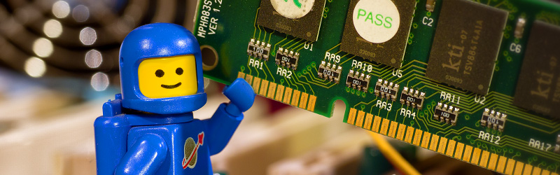 Lego Spaceman adding memory to a computer